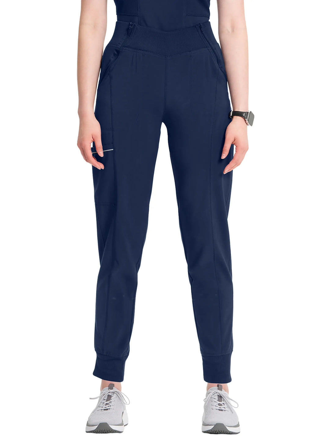 A look at the front of the Infinity Women's Mid-Rise Tapered Jogger Scrub Pant in Navy Blue featuring a rib knit elastic waistband.