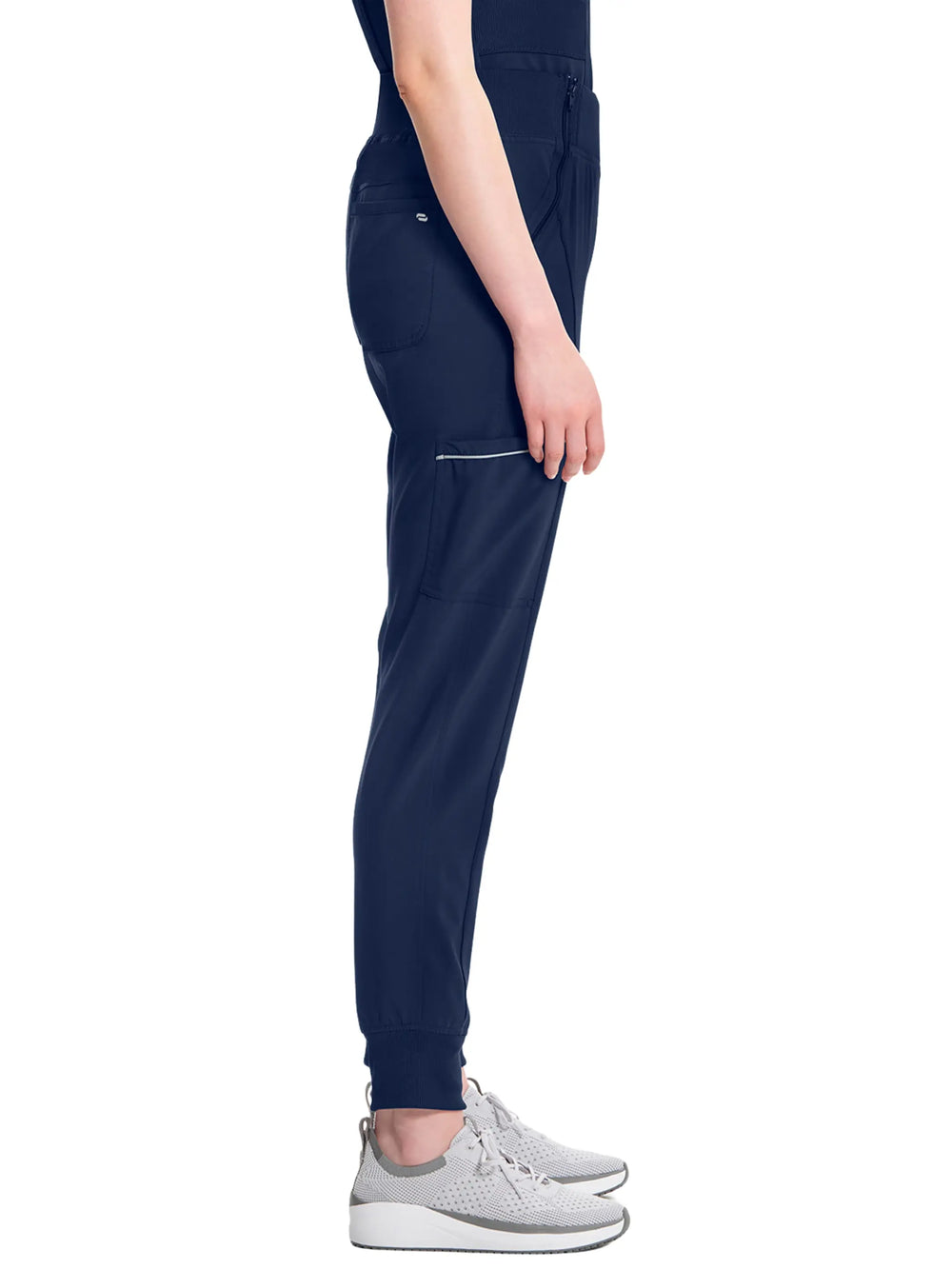 A look at the side of the Infinity Women's Mid Rise Tapered Jogger in Navy Blue size Medium featuring ankle cuffs and an antimicrobial fabric.