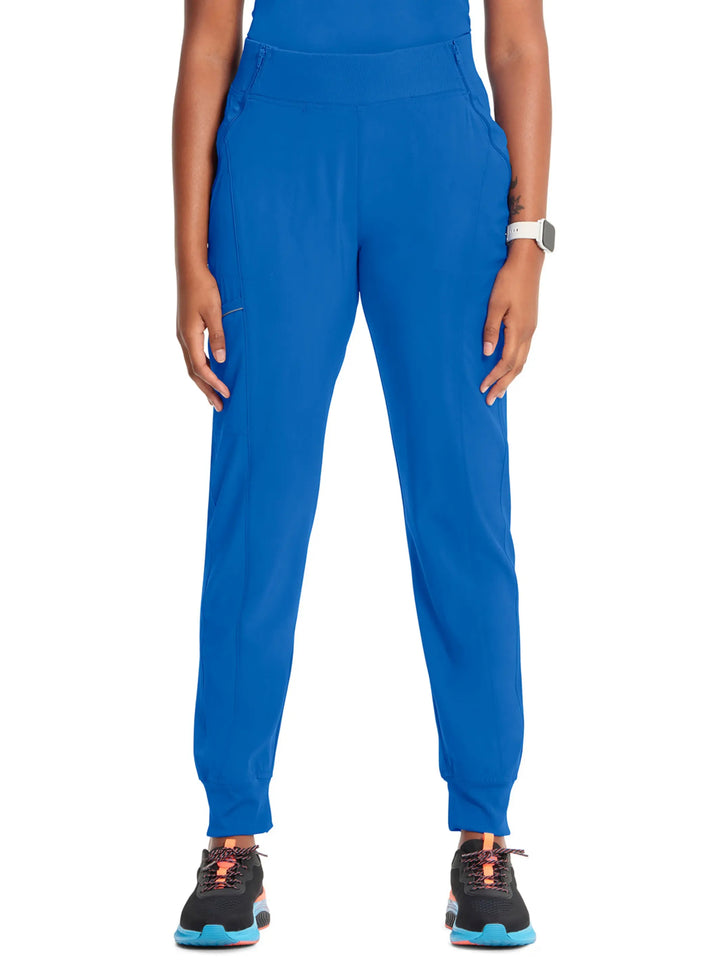 A look at the front of the Infinity Women's Mid-Rise Tapered Jogger Scrub Pant in Royal Blue featuring a rib knit elastic waistband.