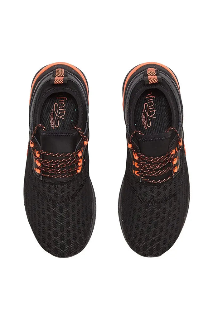 A top down look at the Infinity Women's Dart Premium Athletic Shoes in Electro Coral size 9.5 featuring a removable PU insole that offers arch support and heel cupping for additional comfort throughout the day.