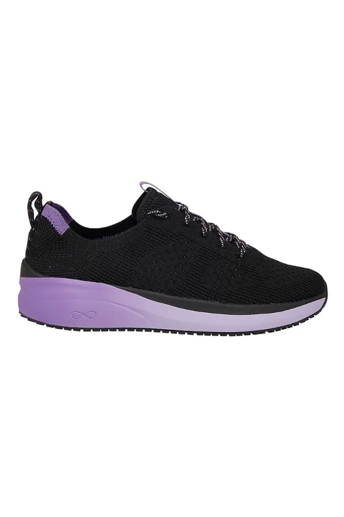 The outside of the Infinity Women's Ever On Knit Athletic nurse Shoe in Purple Surge size 6.5 featuring an AERON™ EVA midsole that is thicker in the heel for cushioning.