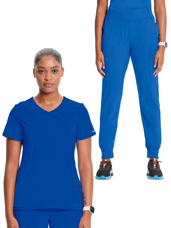 A look at the Infinity Women’s Mock Wrap Antimicrobial Scrub Top and the Infinity Women's Mid-Rise Tapered Jogger Scrub Pant in Royal Blue.