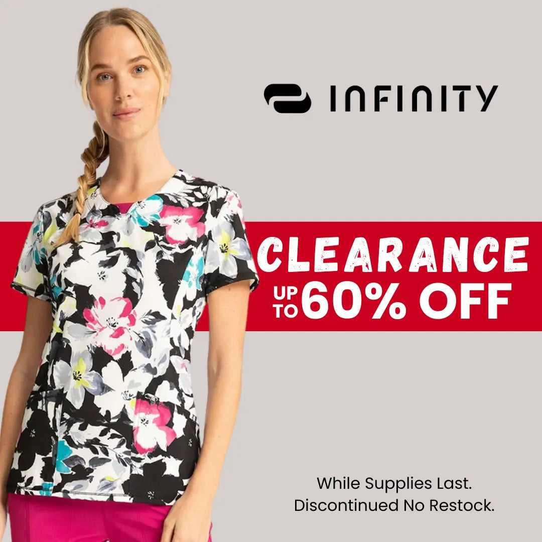 A female nurse wearing a print scrub top from Scrub Pro Uniforms' Infinity Clearance section on a light grey background.