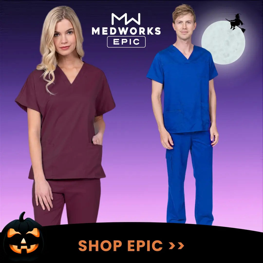 Two young nurses displaying some of the available styles in Scrub Pro's collection of Epic by MedWorks scrubs on a Halloween-themed background.