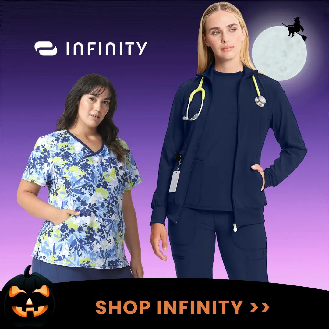 Two young female Healthcare Workers displaying some of the available styles in Scrub Pro's collection of Infinity Medical Uniforms on a Halloween-themed background.