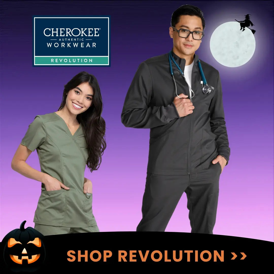 Two young Healthcare Professionals showcasing some of the available styles in Scrub Pro's collection of Cherokee Workwear Revolution on a Halloween-themed background.