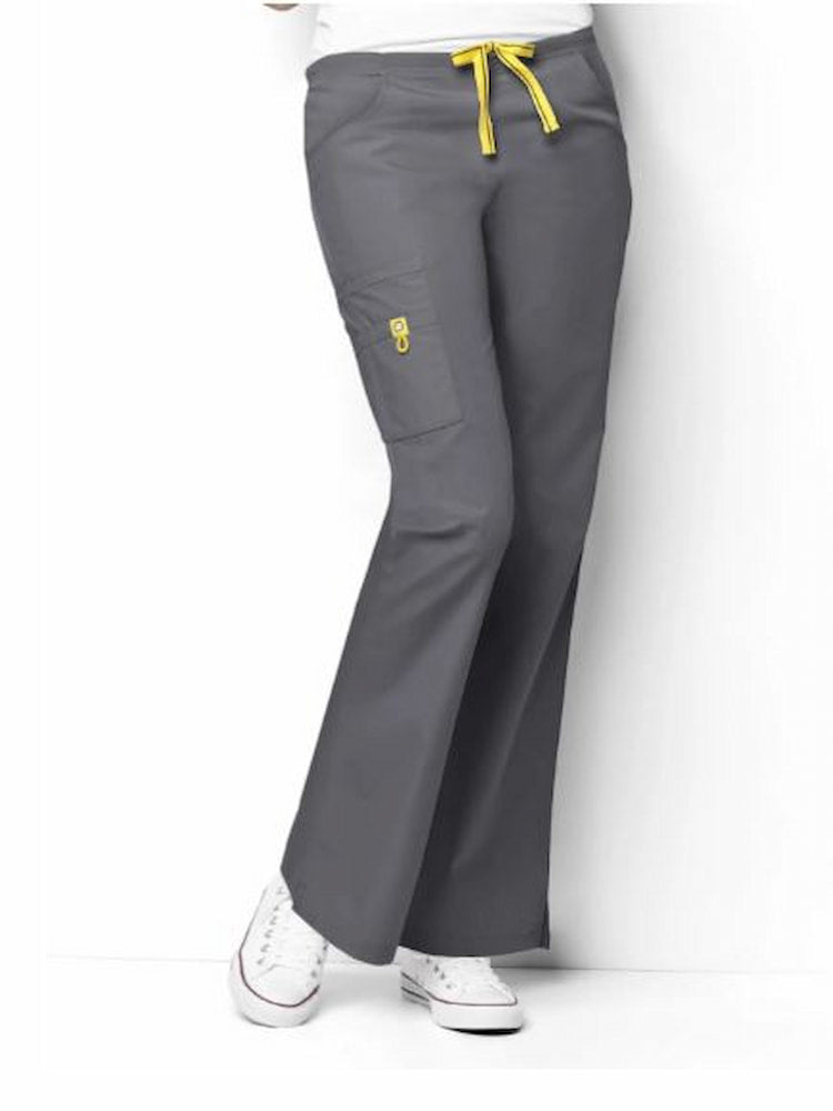 A young female Dental Hygienist wearing a WonderWink Women's Romeo Flare Leg Cargo Scrub pant in Pewter size 2XL Petite featuring a durable poly/cotton blend. 