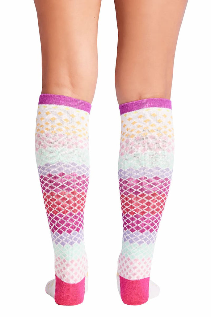 The back of the Cherokee Women's Knee High Compression Socks in Pure featuring a non-binding top band that prevents the sock the from falling down throughout the day without restricting circulation.
