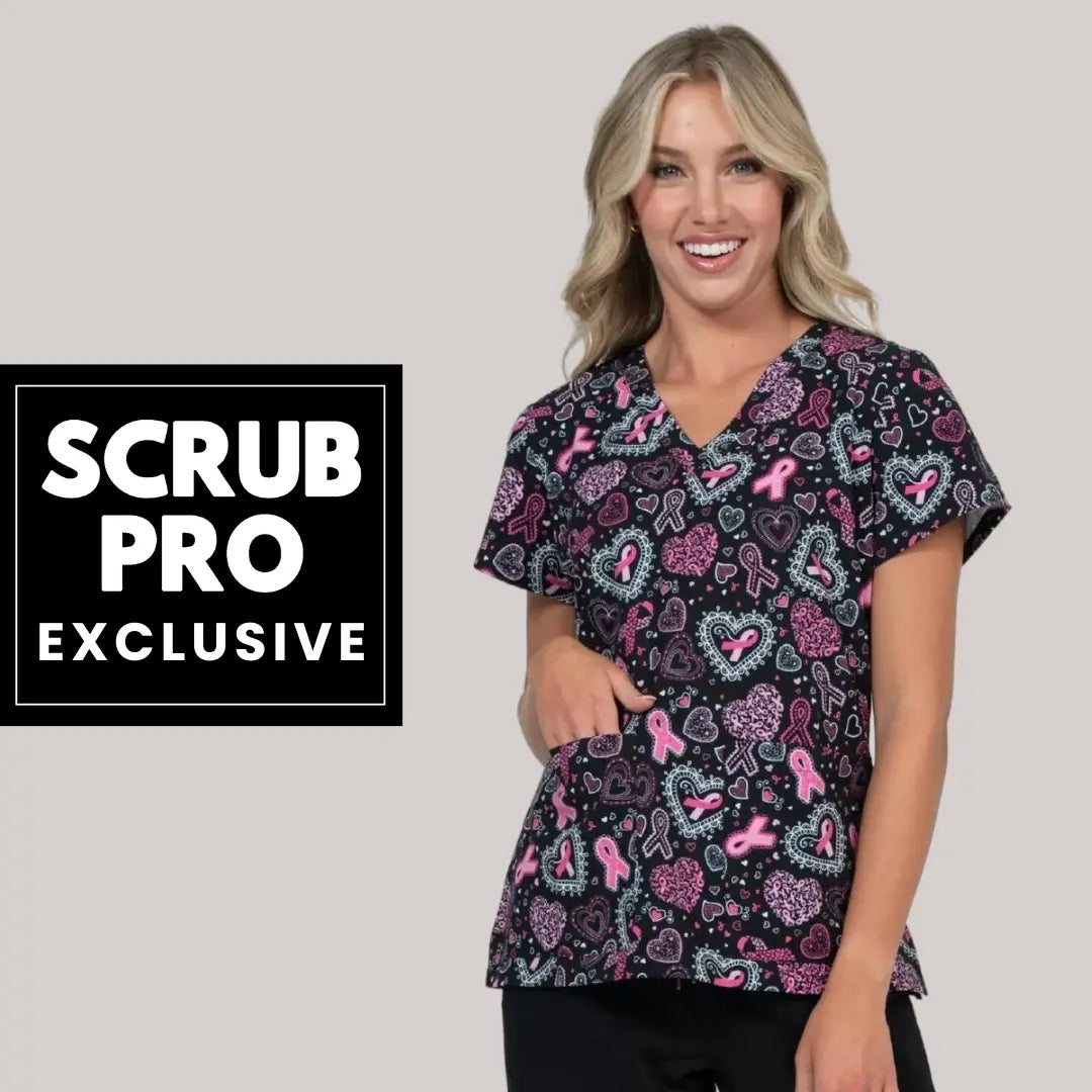 A young female Pediatric Nurse displaying one of the available products in Scrub Pro's collection of Exclusive Women's Print Scrub Tops.