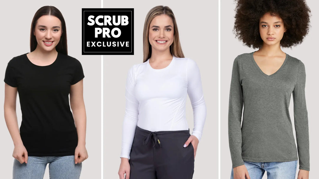 Three young women displaying some of the available t-shirt styles in Scrub Pro's Collection of Exclusive Women's Underscrubs on a light grey background.