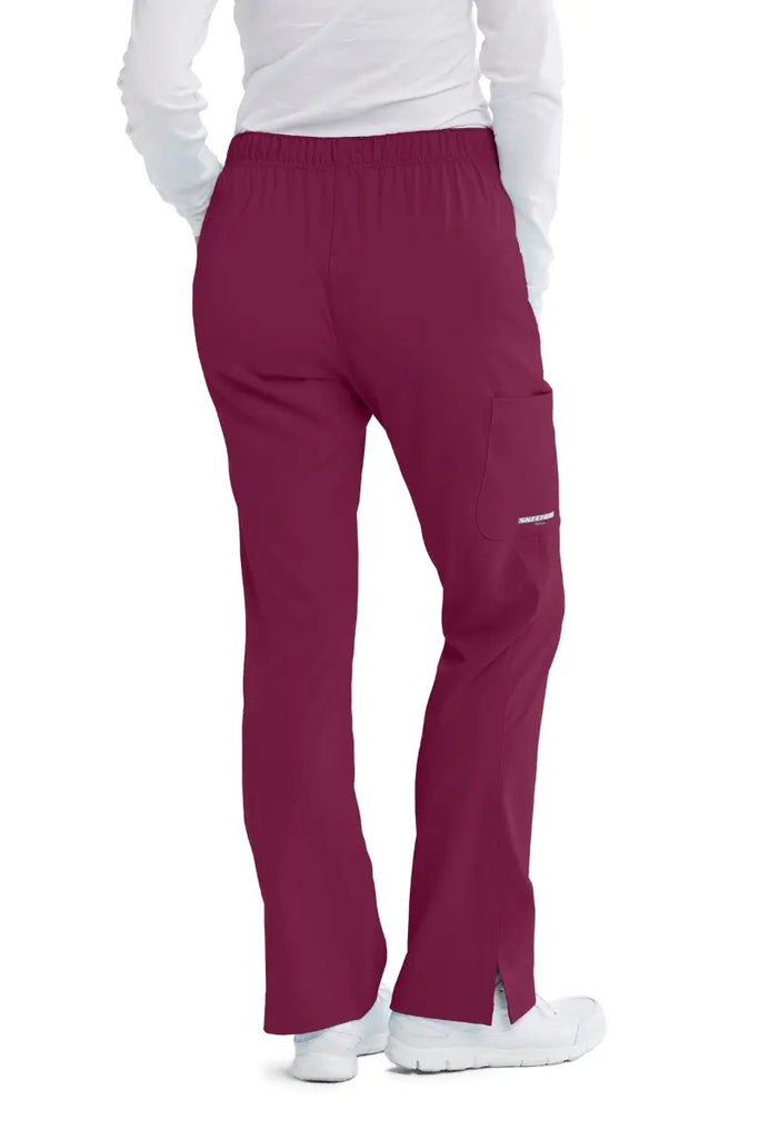 The back of the Skechers Women's Reliance Cargo Scrub Pant in Wine featuring a back elastic waistband with an adjustable drawstring closure.