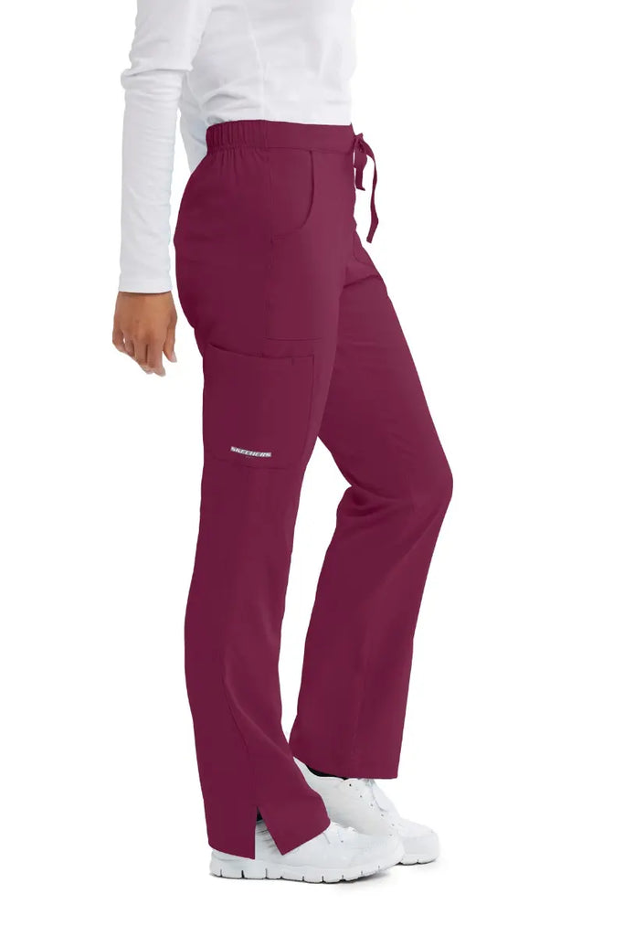 The right side of the Skechers Women's Reliance Cargo Scrub Pants in Wine size Medium featuring a side cargo pocket.