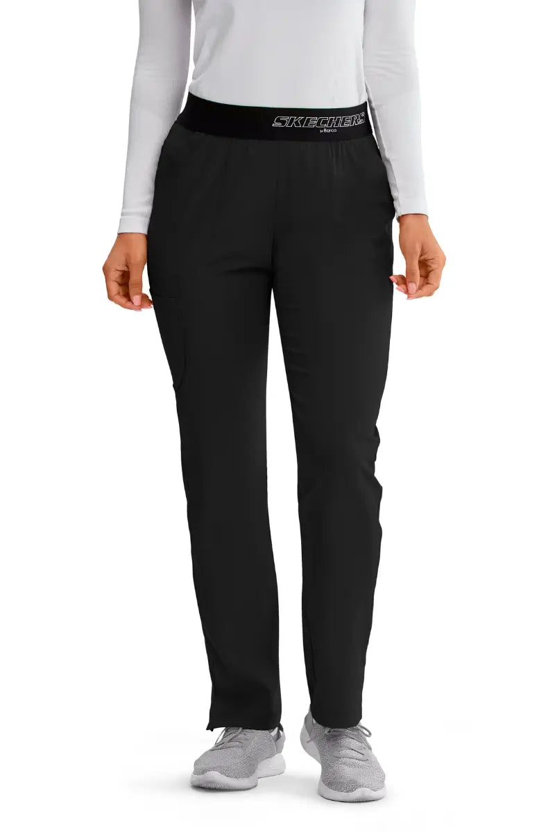 The front of the Skechers Women's Vitality Scrub Pants in Black featuring a fully elastic waistband with the Skechers logo printed on the front.