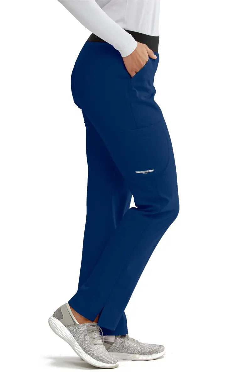 The right side of the Skechers Women's Elastic Waist vitlity Scrub Pants in Navy size medium featuring an outside cargo pocket located on the wearer's right side.