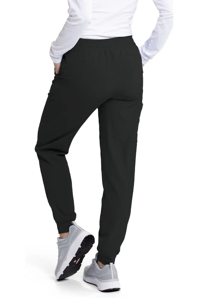 The back of the Skechers Women's Theory Scrub Jogger in Black featuring ankle cuffs for an athletic look.