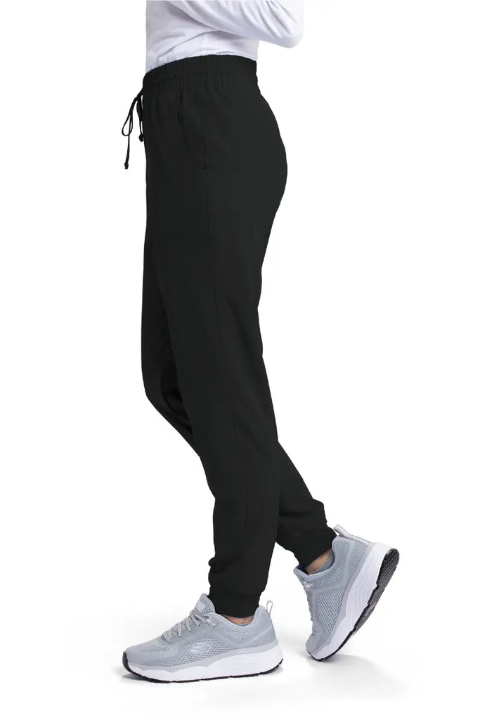 The left side of the Skechers Women's Theory Scrub Jogger in Black size XS featuring a drawstring waist.