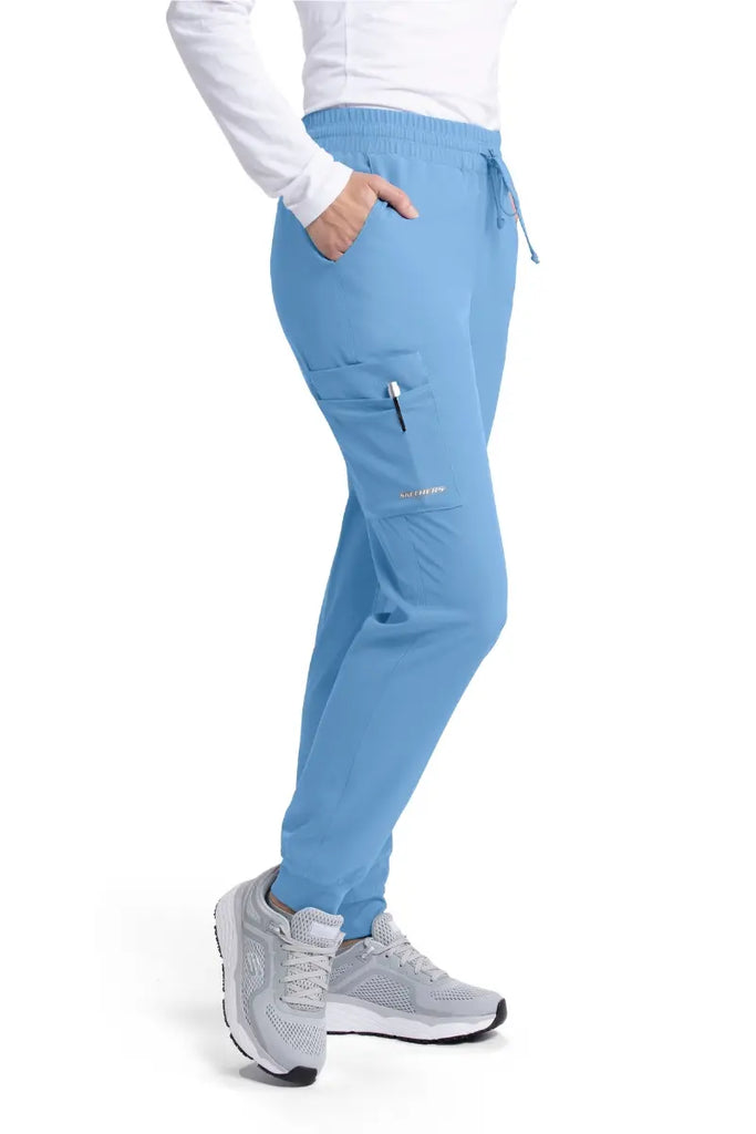 The right side of the Skechers Women's Theory Scrub Joggers featuring an exterior cargo pocket on the wearer's right side.
