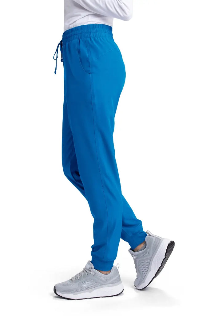 The left side of the Skechers Women's Theory Scrub Jogger in New Royal featuring a drawstring waistband.
