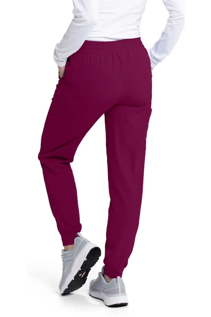 The back of the Skechers Women's Theory Jogger in Wine size Large featuring tapered ankles for an athletic look and feel.