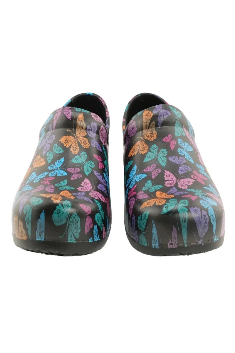 A look at the front of a pair of the StepZ Women's Slip Resistant Nurse Clogs in Vivid Butterflies featuring a vibrant pattern of multi-colored butterflies on a black background.