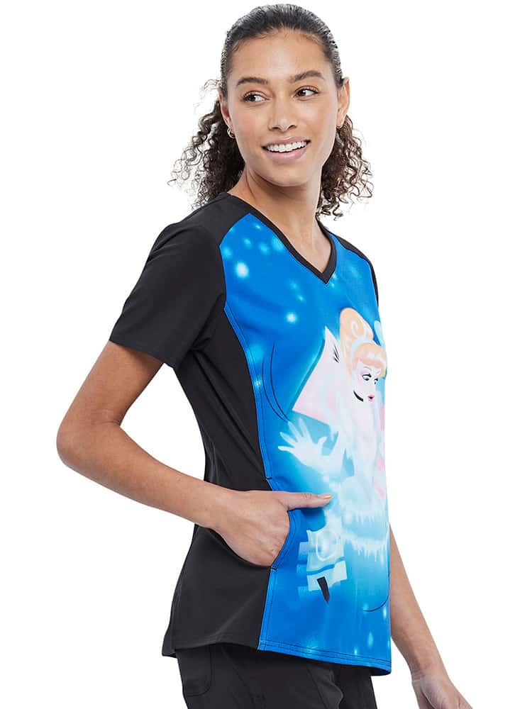 A young female Veterinarian wearing a Tooniforms Women's V-Neck Print Scrub Top in "Don't Be late" size small made of 95% polyester & 5% spandex.