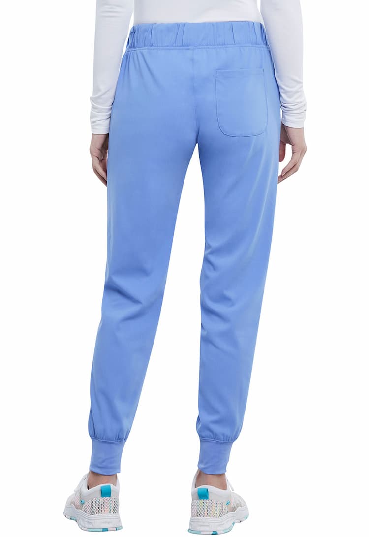 A young female Physician;s Assistant Wearing a Vince Camuto Women's Mid Rise Drawstring Jogger in Ceil size Large Tall featuring a single back patch pocket on the wearer's right side.