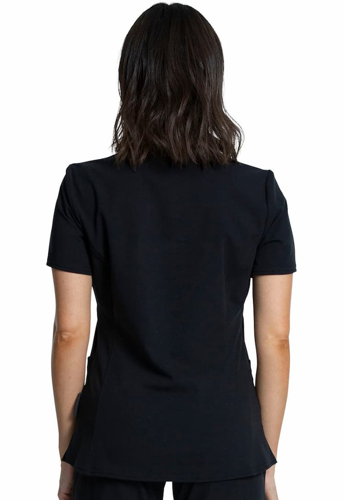 An image of a young female Physical Therapist wearing a Vince Camuto Women's V-Neck Scrub Top in Black size Medium featuring a center back length of 26".