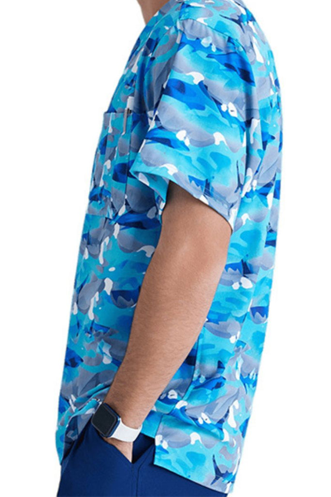A close look at the side of the Skechers Men's Structure Crossover V-neck Printed Scrub Top in "Wild Tide" featuring side vents for enhanced breathability and range of motion, keeping you feeling cool and comfortable throughout your shift.