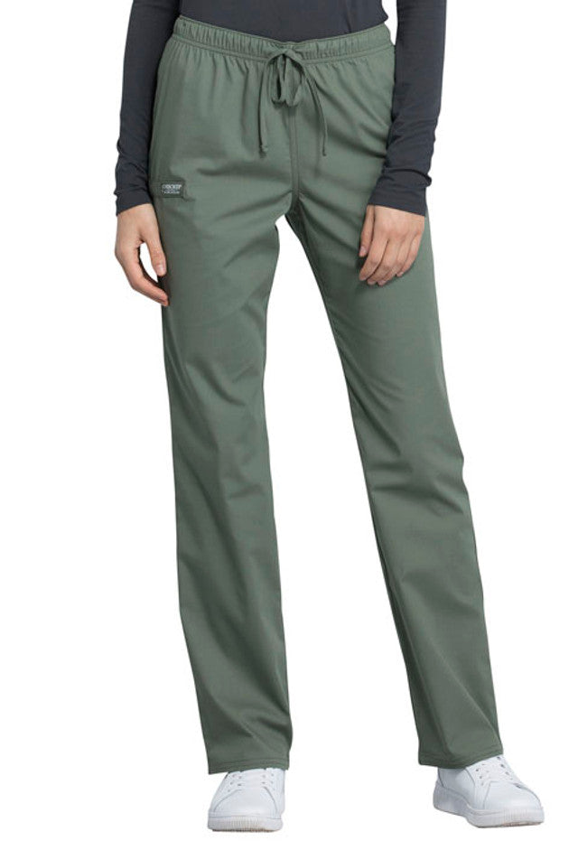 A young female surgeon showcasing the front of the Cherokee Unisex Pocketless Scrub Pant in Olive featuring a exterior drawstring waist.