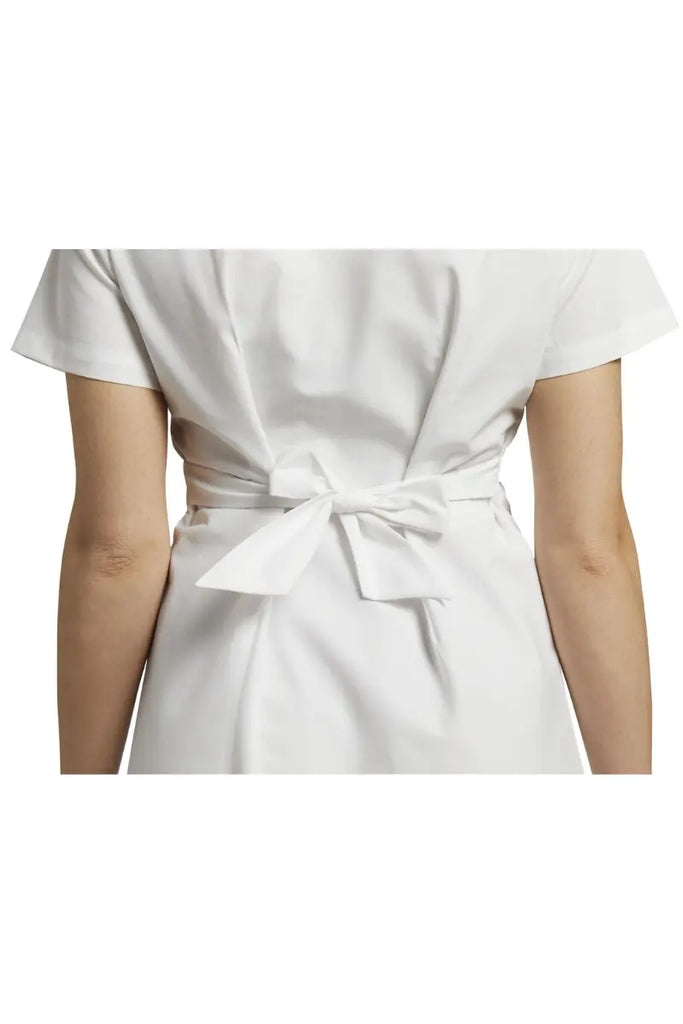 White Cross Mock Wrap dress has a tie back feature for a more fitted look.