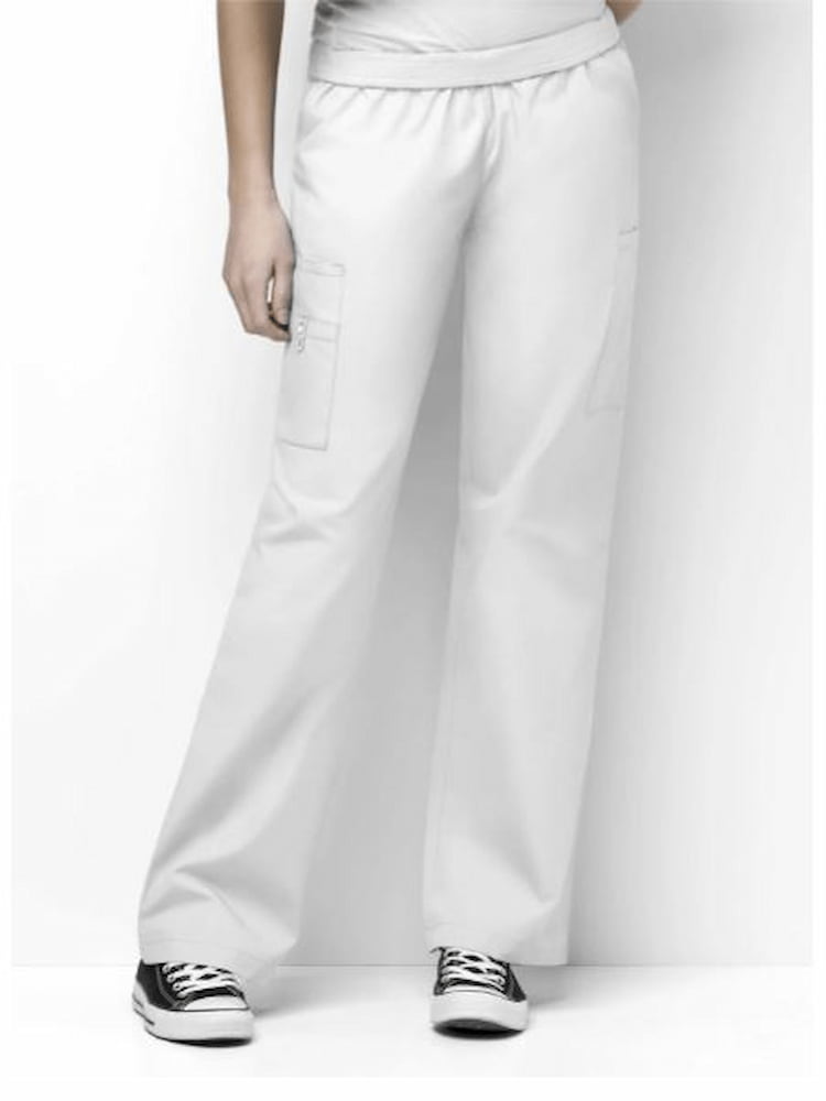 A young female Registered Nurse wearing a WonderWink Women's Elastic Waist Quebec Cargo Pant in White size medium petite featuring two front patch pockets.