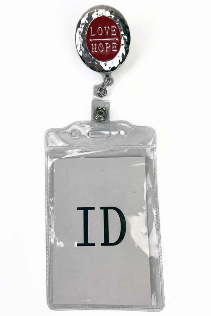 The Badge Reel with ID Holder in Love and Hope featuring a removable vinyl badge holder.