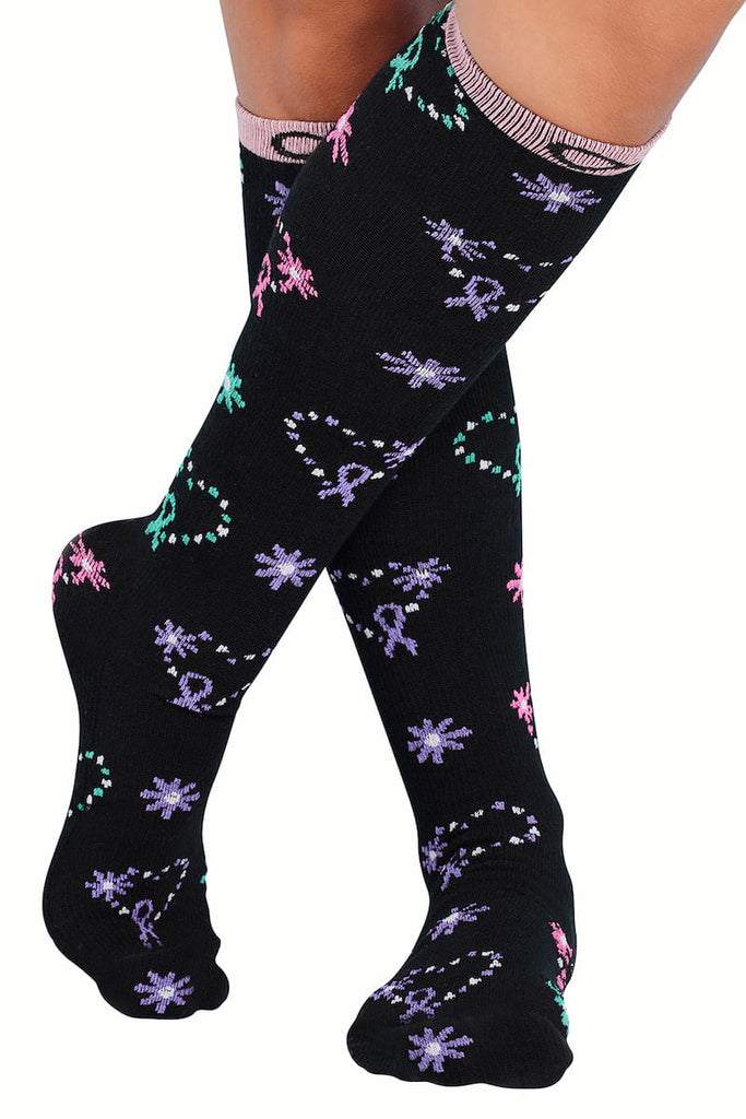 The front of the Infinity Women's Kickstart Compression Socks in Care for All featuring a stylish heart themed print in shades of purple, pink and green.