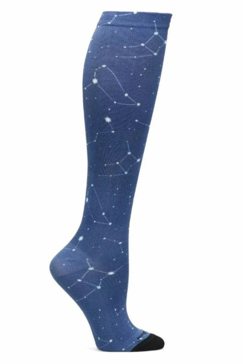 A look at the NurseMates Women's 360° Compression Sock in Celestial Sky featuring a unique print of the night sky on a navy blue background.