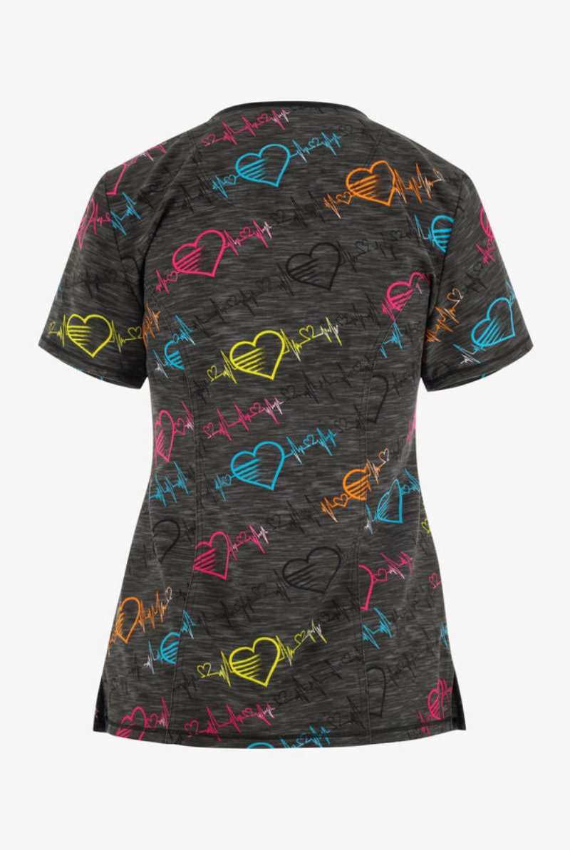 The back of the Cherokee Infinity Women's Round Neck Printed Scrub Top in "Pop Beats" size medium featuring princess seams throughout.