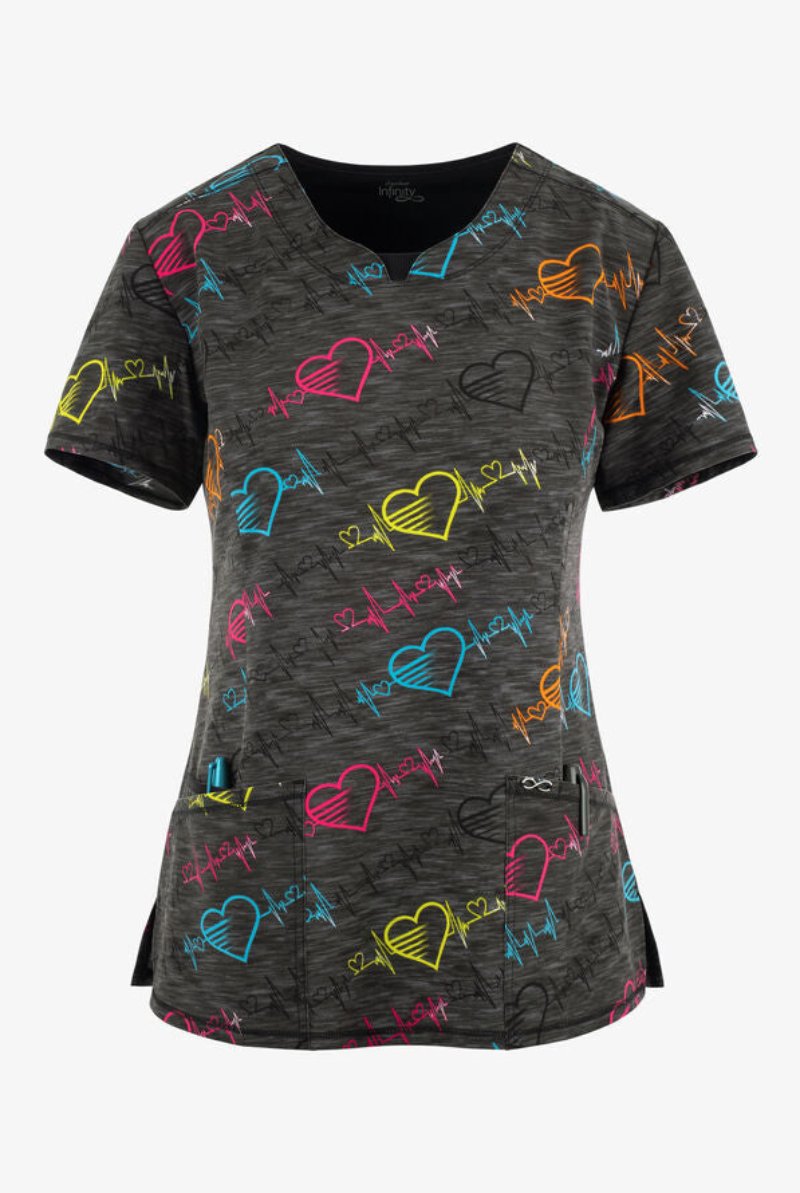 The front of the Cherokee Infinity Woman's Round Neck Printed Scrub Top in "Pop Beats" size XS featuring a contemporary fit.