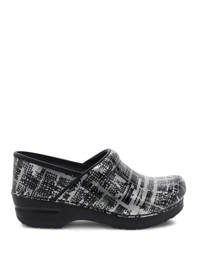 The Dansko Professional Nurse Shoes in Block Print Patent featuring Patent-pending stapled construction.