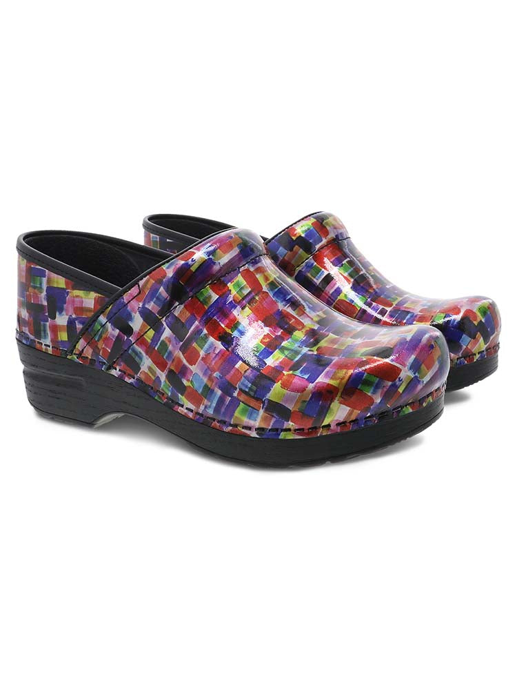 A pair of Dansko Professional Nurse Shoes in "Color Block Patent" featuring a unique, colorful design.