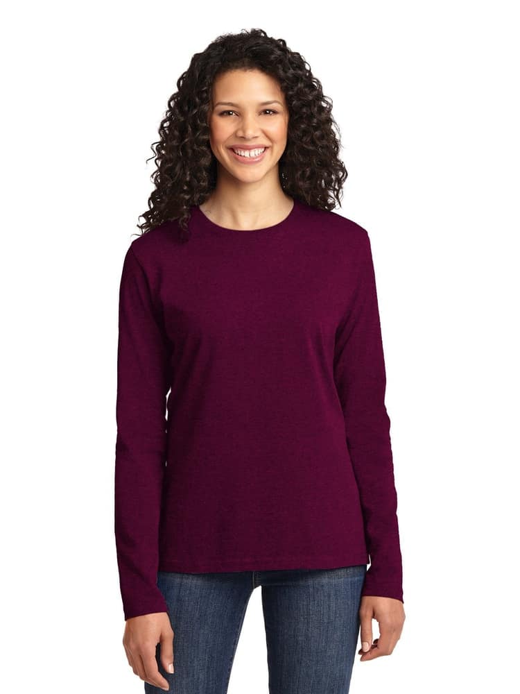 A young female healthcare professional wearing a Flexibilitee Women's Crew Neck Long Sleeve Tee in Magenta size XL featuring a tag-les neckline for unmatched all day comfort.