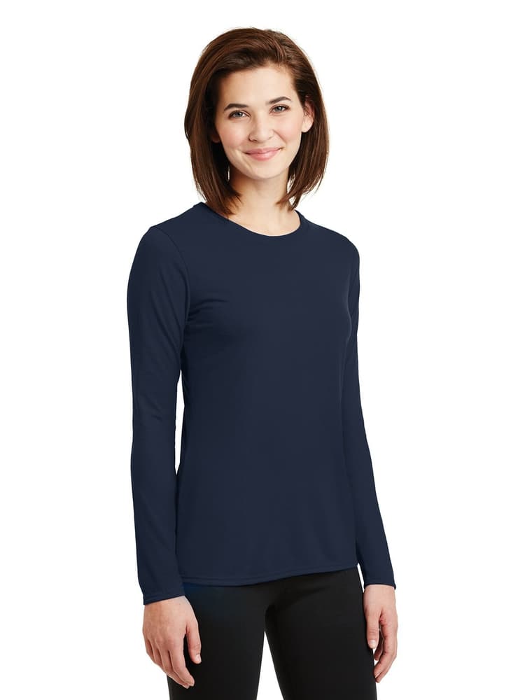 A young female LPN wearing a Flexibilitee Women's Crew Neck Long Sleeve T-Shirt in Navy size XS featuring a rib knit collar.