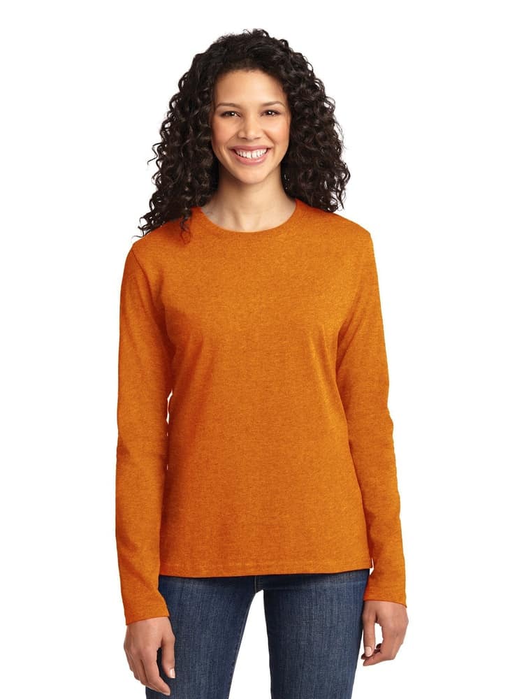 A young female Healthcare Professional wearing a Flexibilitee Women's Crew Neck Long Sleeve Tee in Orange size XL featuring a tag-less neckline for maximum all day comfort. 