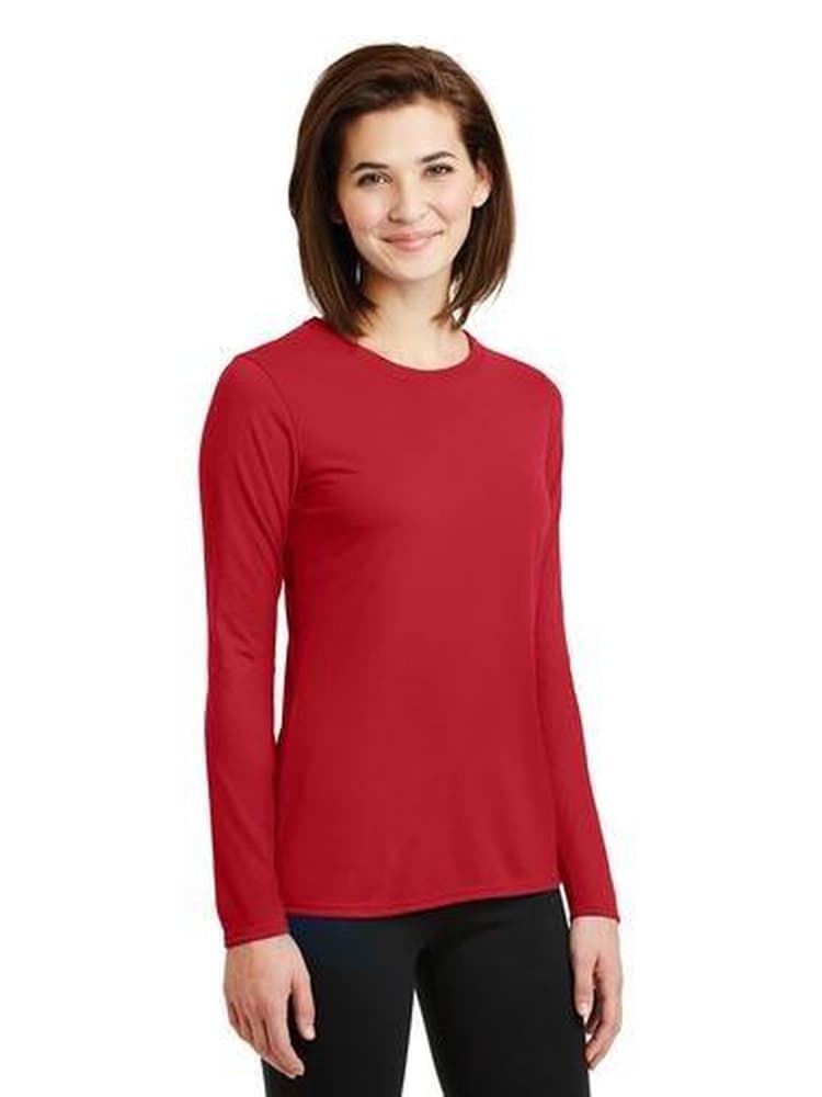 Chiropractor wearing Flexibilitee women's Crew Neck Long Sleeve Tee in red size large