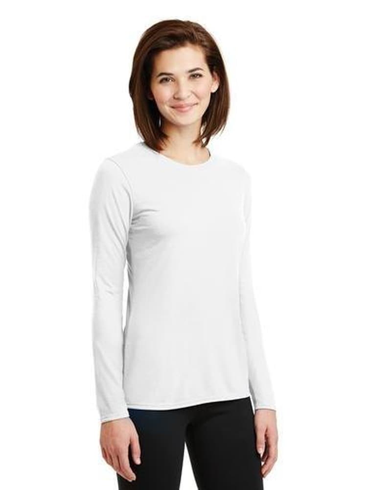 A young female Nurse Practitioner wearing a Flexibilitee Women's Crew Neck Long Sleeve T-Shirt in White size Medium on a solid, white background.