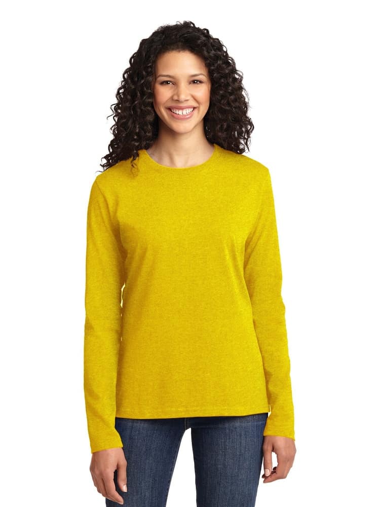A young female Medical Assistant wearing a Flexibilitee Women's Crew Neck Long Sleeve Tee in Yellow size XS featuring a crew neckline with a rib knit collar.