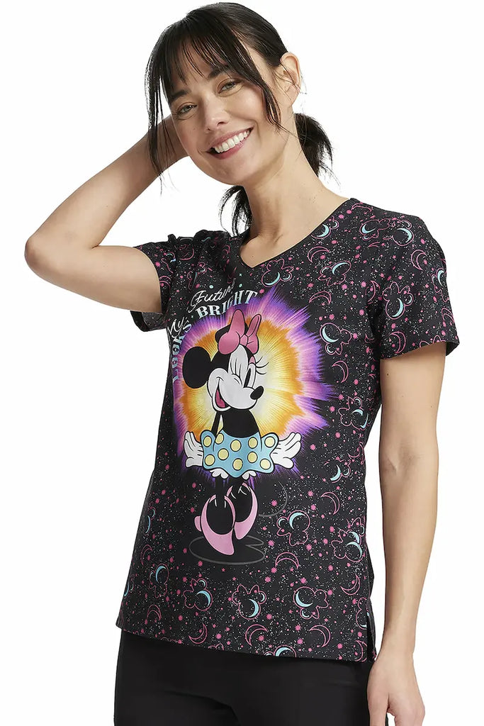 A young female Neonatal Nurse wearing a Tooniforms Women's V-neck Printed Scrub Top in "My Bright Future" in size Medium featuring a Modern Classic Fit.