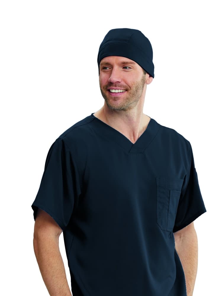 A male LPN wearing a Grey's Anatomy Unisex Fitted Scrub Cap in Steel Grey featuring a stylish one size fits most design.