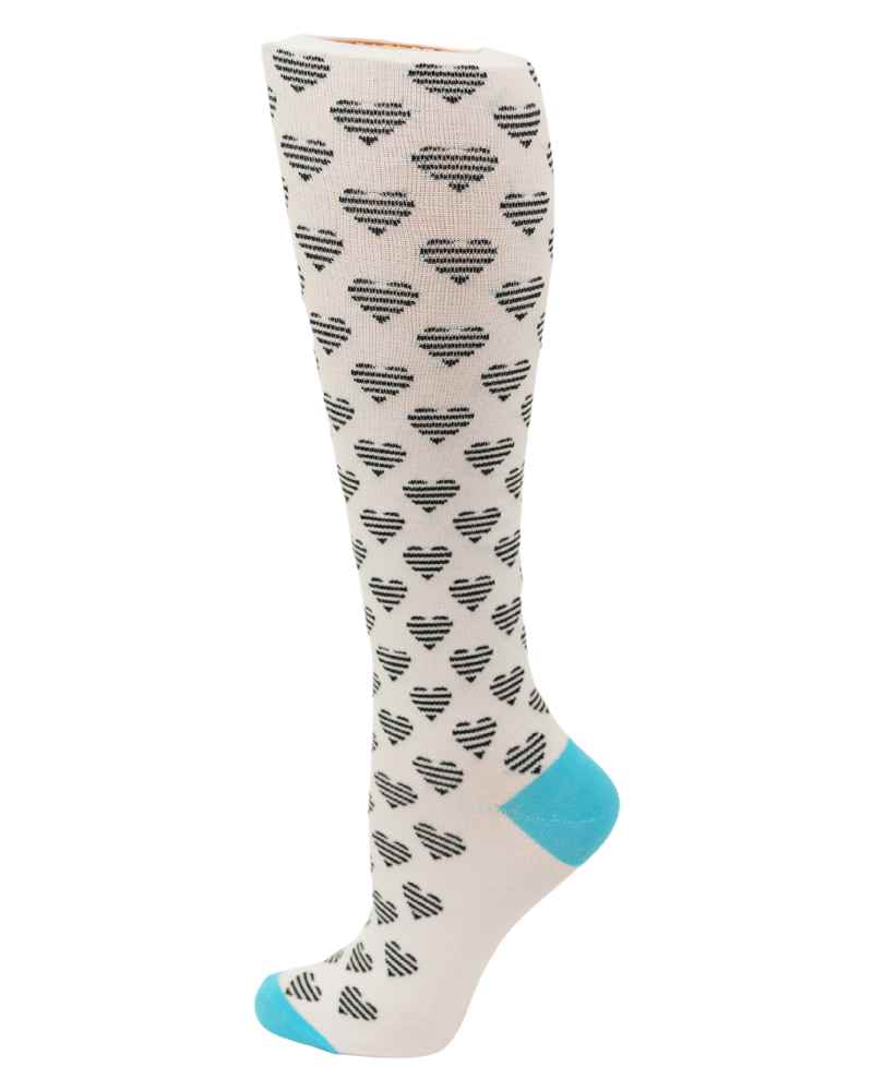 An image of the Pro-Motion Women's Compression Socks in the White & Black Hearts Print featuring 8-15 mmHg of compression.