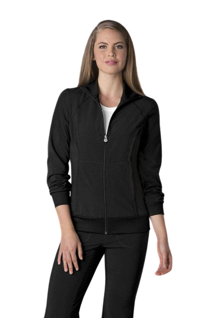 A young female Medical Secretary wearing a Cherokee Infinity Women's Antimicrobial Warm Up Jacket in Black size medium featuring a zip front & a moisture wicking fabric.