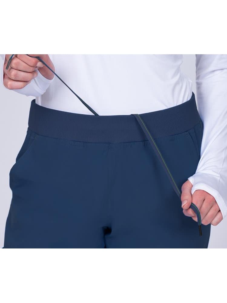 Meraki Sport Women's Jogger Scrub Pant in navy featuring a drawstring & an elastic rib knit waistband