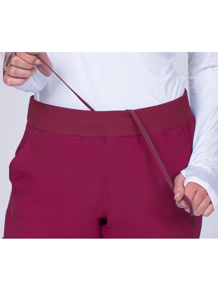 Meraki Sport Women's Jogger Scrub Pant in wine featuring a drawstring & an elastic rib knit waistband